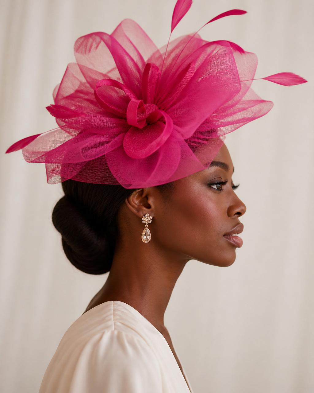 The finished fuchsia tulle fascinator worn elegantly